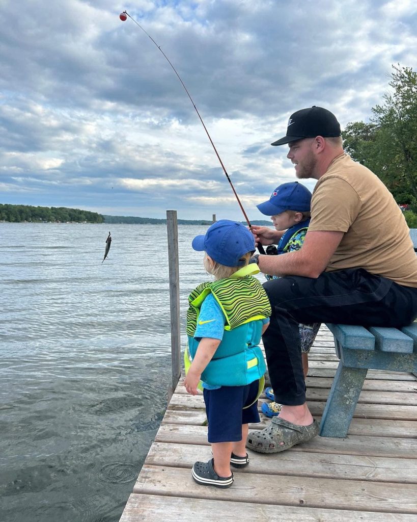 Family enjoying fishing off the dock at Southview Cottages many fishing piers.