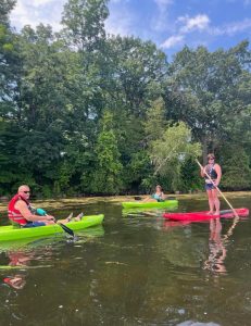 Family enjoying water sport equipment on Rice Lake.